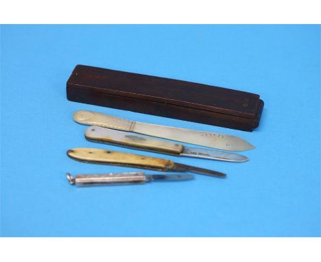 A selection of three fruit knives, one silver with mother of pearl handle and a set of Wilkinson and Ormskirk sovereign scale