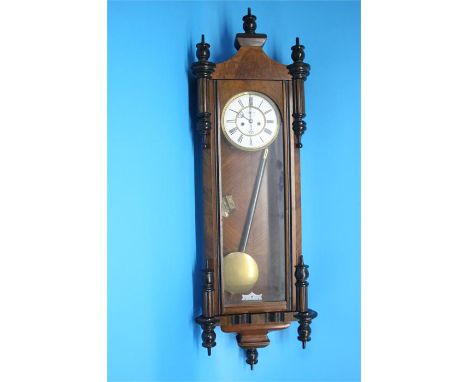 A walnut cased double weight Vienna regulator clock with painted enamel dial, 8 day movement, second hand subsidiary dial.  1