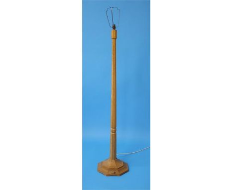 A Robert "Mouseman" Thompson oak standard lamp with carved mouse on an octagonal base.  138 cm high