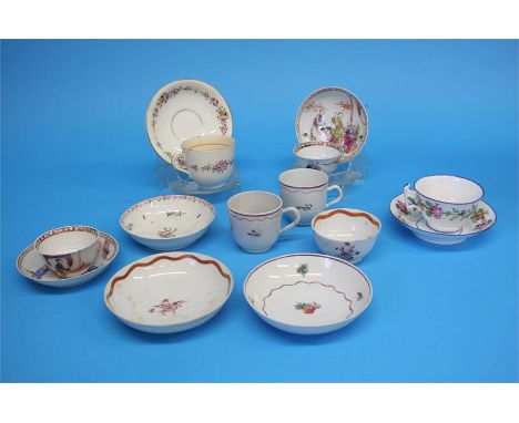 Five tea bowls and saucers and a spare bowl, each decorated with a sprig of flowers, 4 cups and saucers and one tea cup, 2 Or