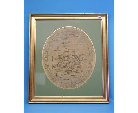 An oval Georgian map sampler of England and Wales with floral banded border, in gilt frame.  52 cm high.  44 cm wide.