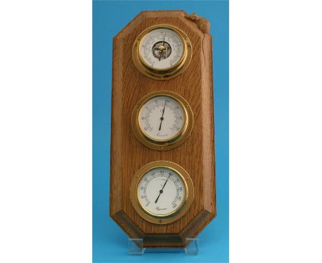 A Robert "Mouseman" Thompson oak 3 glass barometer, thermometer and hydrometer with carved mouse.  44 cm high  19 cm wide
