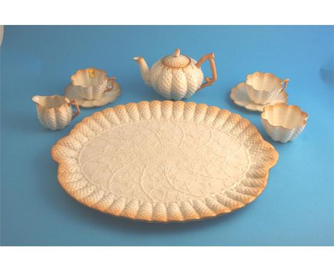 A Belleek tea service comprising large oblong tea tray, teapot, 2 cups and saucers, cream jug and sugar bowl, printed second 