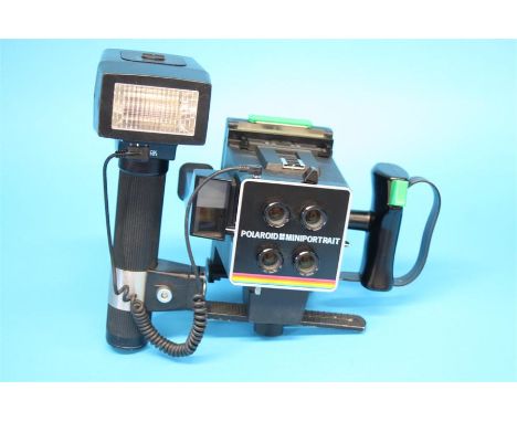 A polaroid mini portrait 402 camera and a Sunpack auto zoom 5000 Thryristor flash.