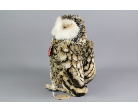 A Steiff Studio Mohair Owl; the owl bears a button on his wing nr 2593/28, glass eyes, approx 30 cms h.&nbsp;