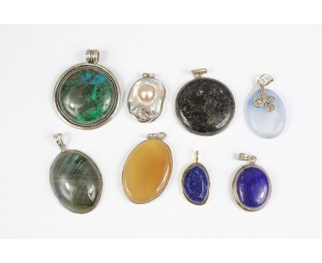 Miscellaneous Hard-stone and Semi-Precious Stone Pendants in silver mounts incl. Lapis Lazuli, Agate and Pearl. (8)