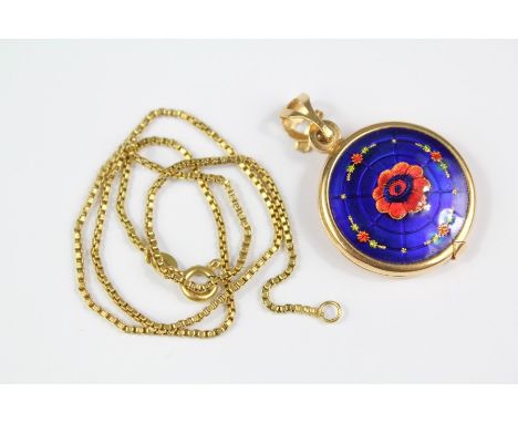 An 18ct Yellow Gold and Enamel Locket Pendant, on a 18ct gold chain approx 33 cms, the circular locket approx 22 mm, approx 1