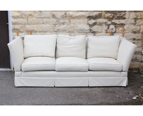 A Large Cream Contemporary Three-Seater Knowle Sofa.