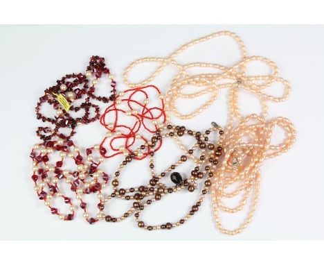 Fresh Water Pearls: Two pink three-strand fresh water pearl necklaces, pearls approx 6 mm, approx 52 cms, on 925 clasps, with