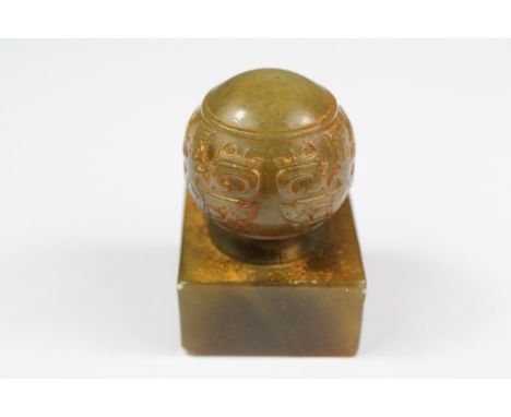 A Chinese Jade Stamp, with rounded grip, approx 6 cms h.