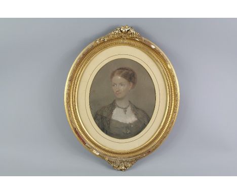 A Victorian Oval Pastel Portrait, depicting a young woman, indistinct signature dated 1860, framed and glazed. (minor foxing 