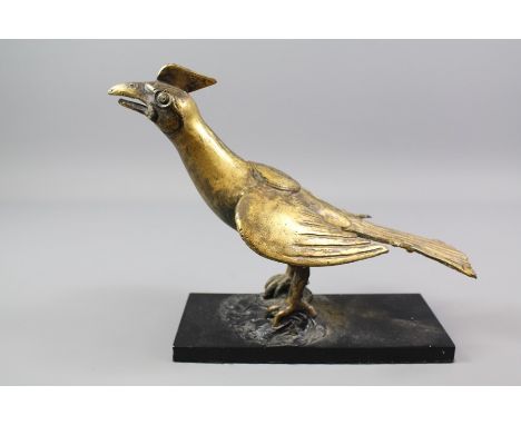 An Antique Gilt Bronze Model of a Winged Bird; the bird with a seal on its back, approx 24 x 20 cms.