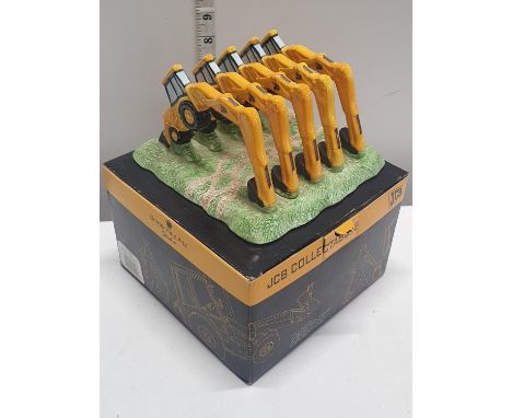 A boxed JCB Dancing Diggers Toast rack by Wade