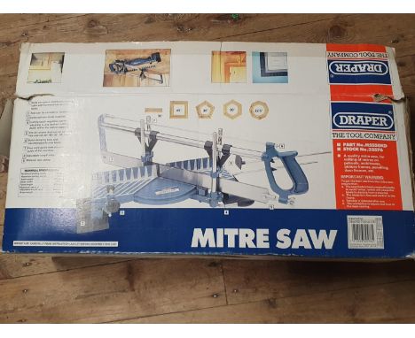 A boxed manual mitre saw, shipping unavailable
