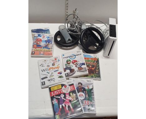 A Wii console and selection of games and accessories (untested),
