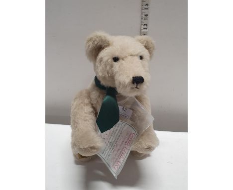 A Merrythought bear 'Grey Heart' with tags.