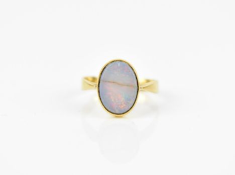 A Victorian 22ct yellow gold and black opal dress ring, set with oval cabochon stone, the shank hallmarked fully, size K, wei