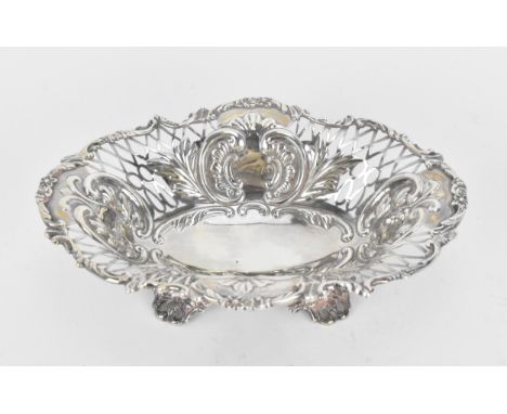 A late Victorian silver pierced bonbon dish by William Hutton &amp; Sons, London 1894, of oval form with lattice basket borde