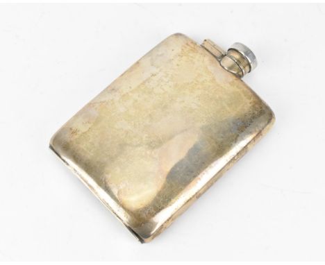 A George V silver hip flask by William Neale &amp; Son Ltd, London 1929, of slight curved form with twist cap, 13.5 cm high, 