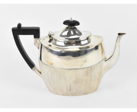 A Victorian silver teapot by James Dixon &amp; Sons Ltd, Sheffield 1889, with part fluted oval body, the hinged lid with ebon