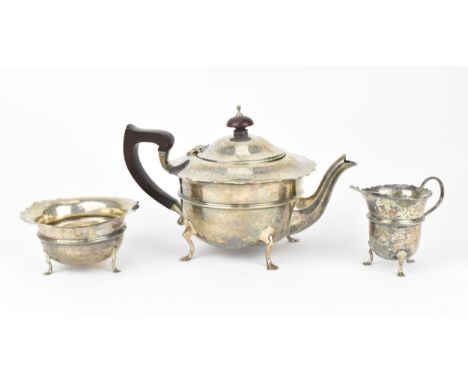 A George V silver three-piece tea set by Robert William Jay, Birmingham 1932, comprising a teapot, sugar bowl and milk jug, e