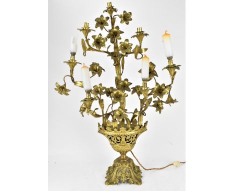 A late 19th century Louis XVI style ormolu candelabra, designed as pierced vase holding floral branches with seven lights, 80