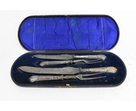 A cased Edwardian four-piece silver-handled carving set by Harrison Brothers &amp; Howson, in the albany pattern, within a bl