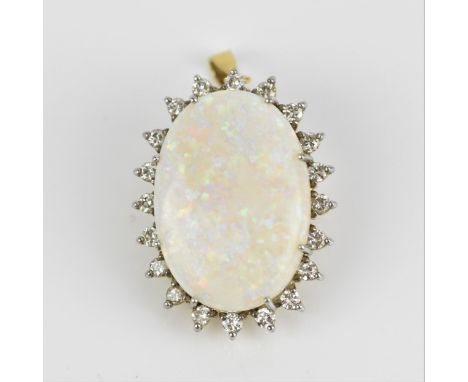 An 18ct yellow gold, white metal, diamond and white opal pendant/brooch, of oval design with central cabochon opal in a halo 