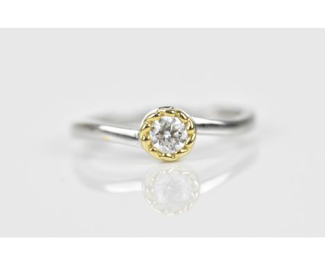 An 18ct white gold and diamond solitaire ring, the round brilliant cut stone approx 0.25 ct, size M 