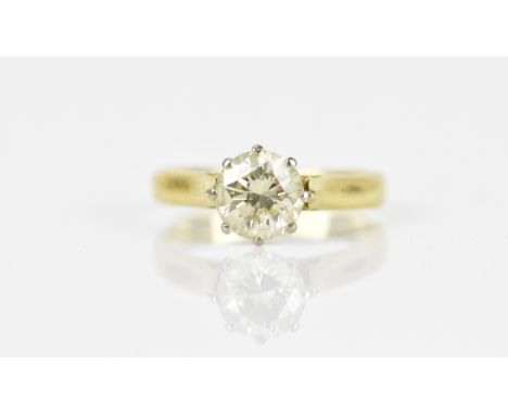 An 18ct yellow gold, white metal and solitaire diamond ring, the brilliant cut stone in an eight claw v-collet setting, the s