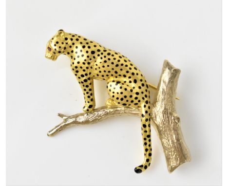An 18ct gold leopard brooch, by Harriet Glen, inset with ruby eyes and applied with enamel spots on a satin finish, sat on a 