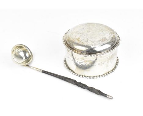 A George III silver toddy ladle, London 1814, with twisted whalebone handle, together with a Continental white metal circular