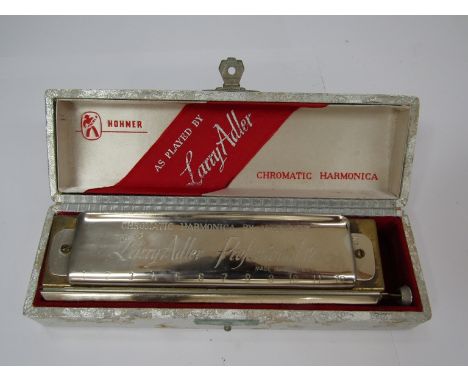 A Larry Adler Professional 12 chromatic harmonica, cased