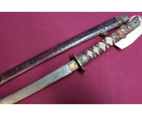 Japanese samurai type sword with 26 inch blade with WWII brown leather covered pattern scabbard with engraved detail to the t