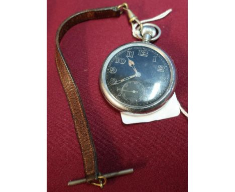 WWII military pocket watch with black face and secondary dial, the reverse with broad arrow mark G.S.T.P A134273 with leather