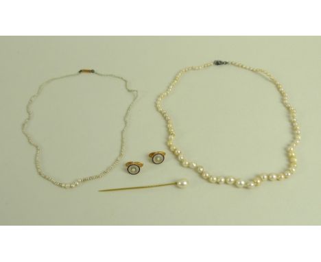 A collection of pearl jewellery, comprising a string of graduated cultured pearls, a string of graduated seed pearls with a 9