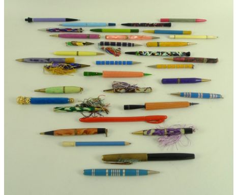 A collection of mostly early to mid 20th century propelling pencils, including marbled plastic examples, together with a foun