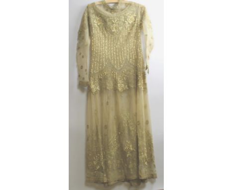 Vintage Textiles: an Art Deco 1920's net overdress, the gold coloured net heavily beaded and embroidered with gold threads.
