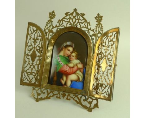 A late 19th century devotional, containing a painted porcelain plaque, of domed rectangular form, depicting the Madonna della