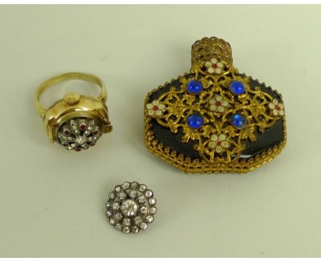 A Milus watch ring, Swiss, gold plated 4-143, the lid decorated with paste diamonds, size P, together with a blue glass perfu