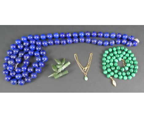 A modern lapis lazuli necklace, formed as a double strand of individually knotted beads with a silver clasp, each bead approx