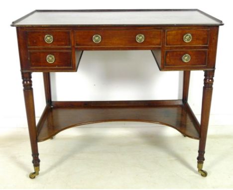 A Regency mahogany washstand, with three quarter beading to the rectangular surface, four frieze drawers over a shaped lower 
