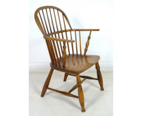 A 19th century oak and ash Windsor low stick back armchair, stamped to each side of the seat 'Braybourn Maker', the turned su