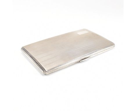 A George VI hallmarked silver cigarette case. The case having an engine turned stripe pattern to the exterior with vacant car