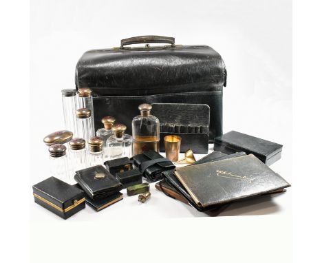 A Victorian silver travelling dressing table set  with silver mounts by Norman Marshall London 1895. The leather Gladstone tr