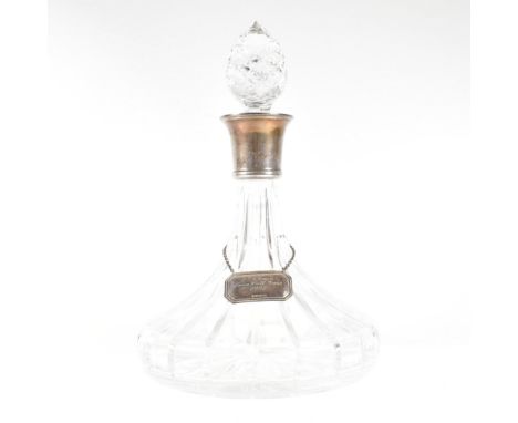 A silver mounted ships decanter complete with stopper and decanter label. Hallmarked Robert Carr (RC) for Sheffield 925 to co