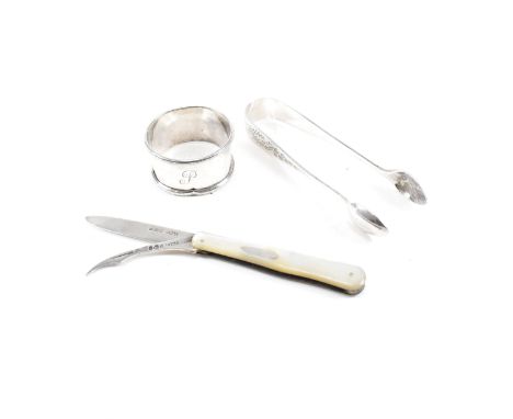 A collection of hallmarked silver items. The lot to include a hallmarked silver and mother of pearl flip knife. The flip knif