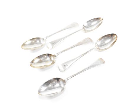 A collection of five George V hallmarked silver table spoons.&nbsp;The five spoons having a fiddle pattern decoration and mon