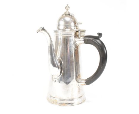 An Edwardian hallmarked Britannia silver coffee pot. The Edward VII pot having a hinged lid, finial and spout and having a ha