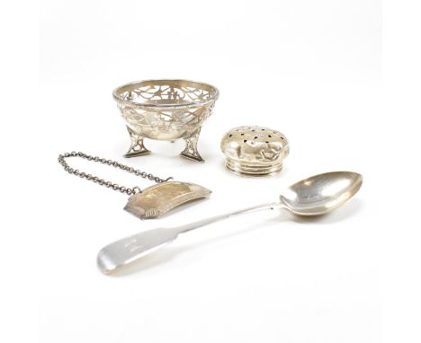 A collection of hallmarked silver items. The lot to include a trinket dish. The dish being raised on three feet and having a 